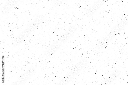A uniform distribution of tiny black particles forming a light speckled appearance against a pure white setting