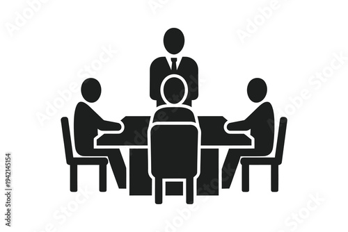 Business meeting with leader standing at head of table and team members seated around, corporate strategy discussion in a conference room setting with a focus on collaboration.