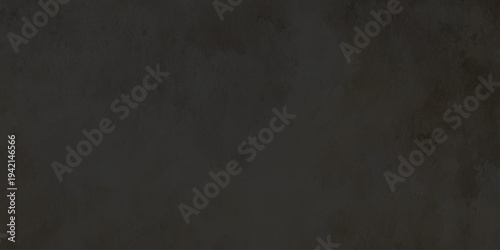A dark textured grunge concrete wall backdrop with a vintage gray stone pattern and a rough dirty surface design