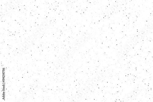 Numerous tiny black flecks appear dispersed on a pure white backdrop creating a dusty effect