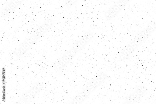 Scattered black specks create a gritty textured surface on a bright white canvas