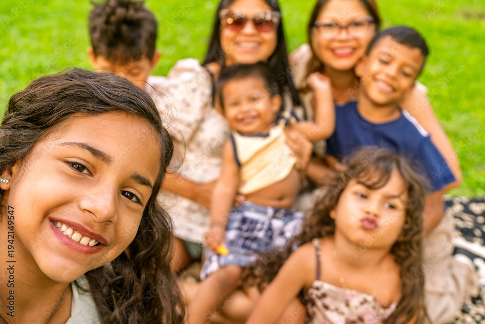 Fototapeta premium Multigenerational family group enjoying time together outdoors