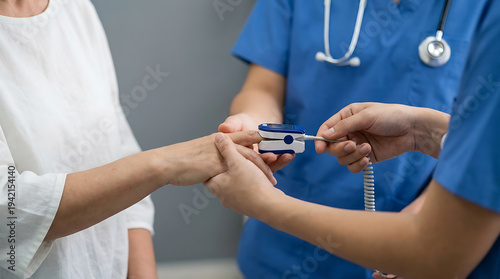 Medical professional checking patient's pulse with oximeter in clinic