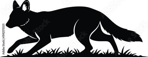 Vector silhouette of a running fox in the grass wildlife design