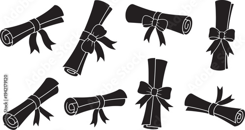 Set of black and white diploma scrolls with ribbons