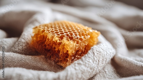 Golden Honeycomb Section with Visible Bee Bread on Linen