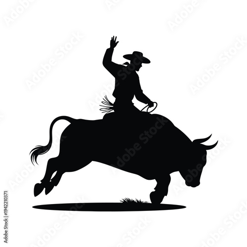 Silhouette of a cowboy riding a bucking bull in a dynamic pose