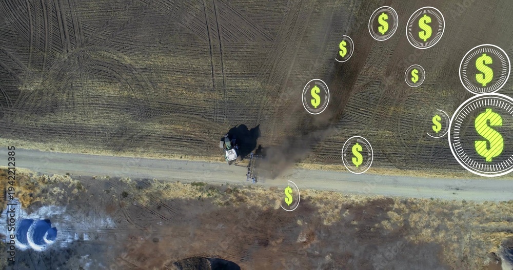 Fototapeta premium Driving tractor pulling plow along dirt road at rural farm, leaving dust plume, dollar icons