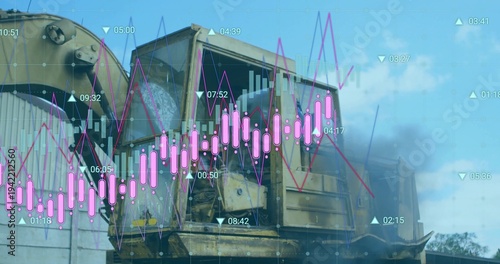 Displaying rusted crusher unit revealing rotating drum on trailer in yard, showing hoses and charts