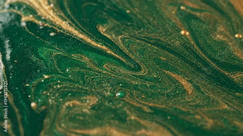 Green and Gold Liquid Swirling Motion.