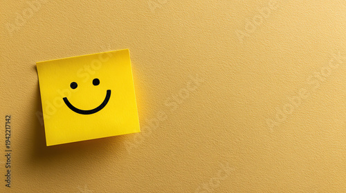 Happy Note on Yellow Background: A simple yellow sticky note with a drawn smiley face, conveying happiness and positivity against a soft yellow backdrop.