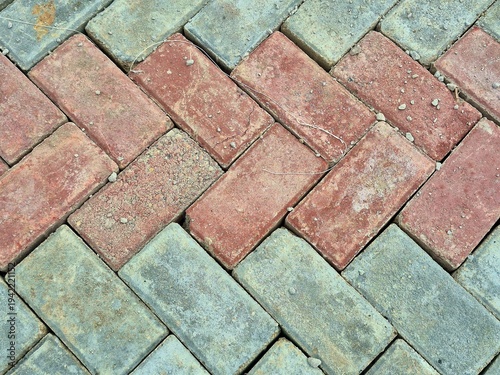 Red and Grey Paving Blocks in Herringbone Pattern Texture