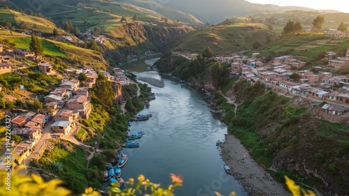 Valley town bisected by a wide river homes clustered on hillsides