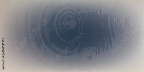 Water ripples creating concentric circles on a dark surface.