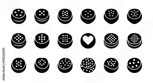 Collection of various black buttons with different designs on a white background viewed from directly above
