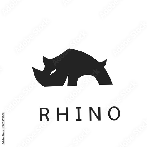 Minimalist rhino head logo design with bold black silhouette and clean typography. Modern vector icon suitable for security, construction, or sports branding seeking a strong, powerful identity