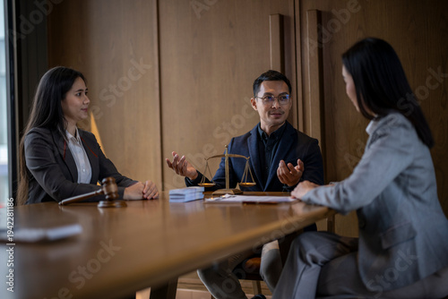 Lawyers consulting clients in legal advice meeting