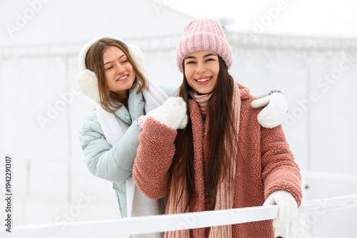 Female friends hugging at s...