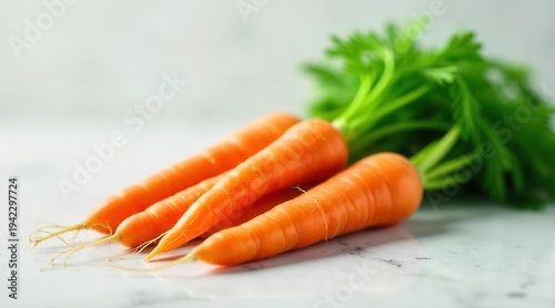 Vibrant orange root vegetables with leafy green tops arranged on a polished surface creating a fresh and healthy display