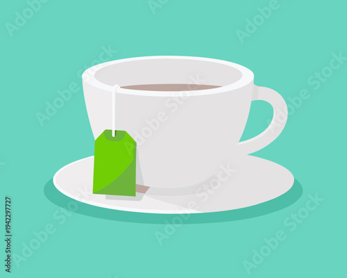 A white cup of tea with a green tea bag on a saucer