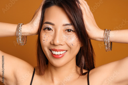 Beautiful young happy Asian...