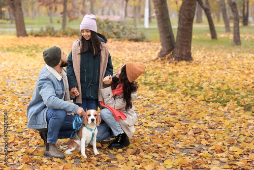 Cute Asian girl with her pa...