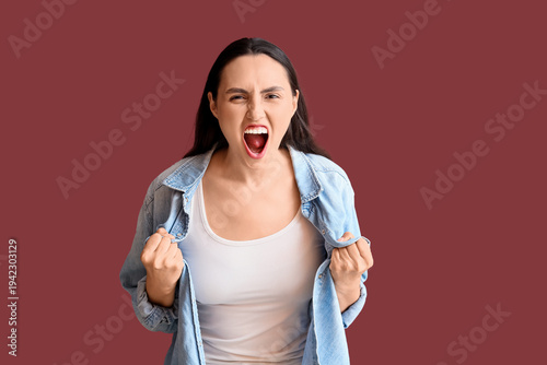 Screaming young woman on bu...