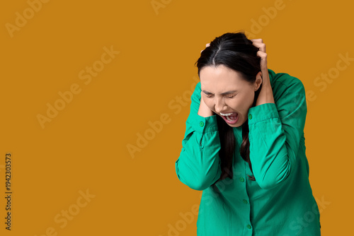 Young woman screaming on or...