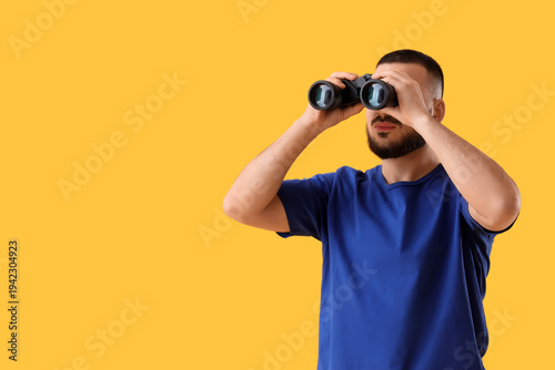 Young man looking through b...