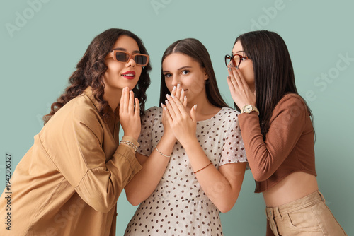 Happy teenage girls gossipi...