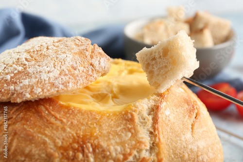 Cheese fondue in bread with...