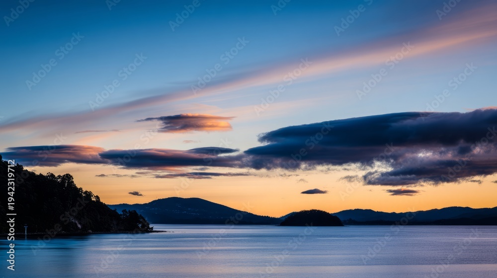 Fototapeta premium wholeness. Golden sunrise over a calm horizon, first light on clouds, serene landscape with deep blue sky. travel magazines, destination branding, designed for outdoor magazines and nature guides. 