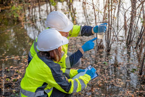 Scientists are collecting water samples for testing in a science lab.