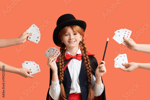 Young magician and hands wi...