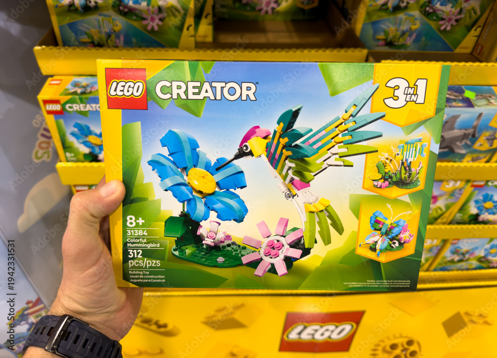 Fototapeta premium LEGO Creator 3 In 1 Tropical Bird Toy Building Set Box Held In Hand At Costco Warehouse Aisle
