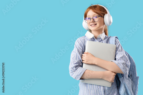 Cute schoolgirl with modern...