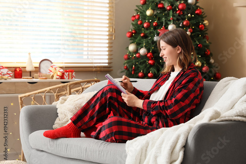 Woman in red plaid pajamas ...