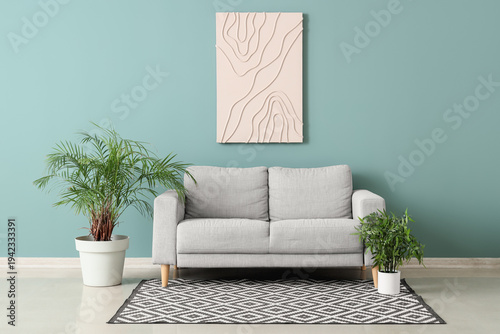 Comfortable grey sofa and h...