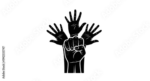 Raised fists symbolizing unity and solidarity in a powerful gesture.