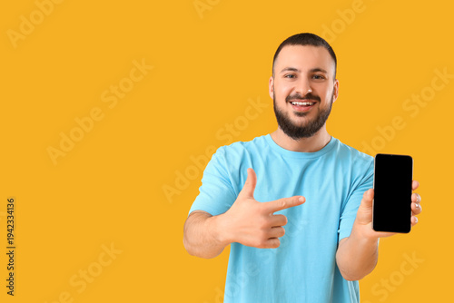 Handsome young man pointing...