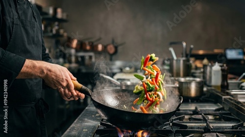Culinary Art in Action: A skilled cook, amidst a bustling kitchen scene, demonstrates the dynamic art of cooking, tossing vibrant vegetables in a hot wok.
