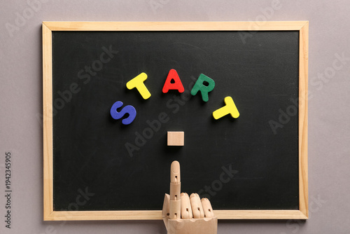 Chalkboard with word START,...