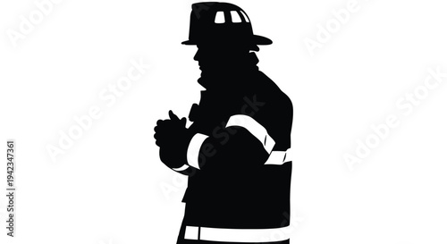 Silhouette of a firefighter in full gear facing slightly to the left