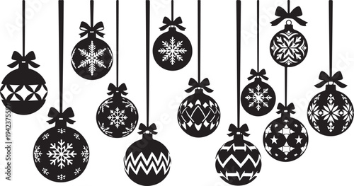 Black and white Christmas ornaments hanging in a row