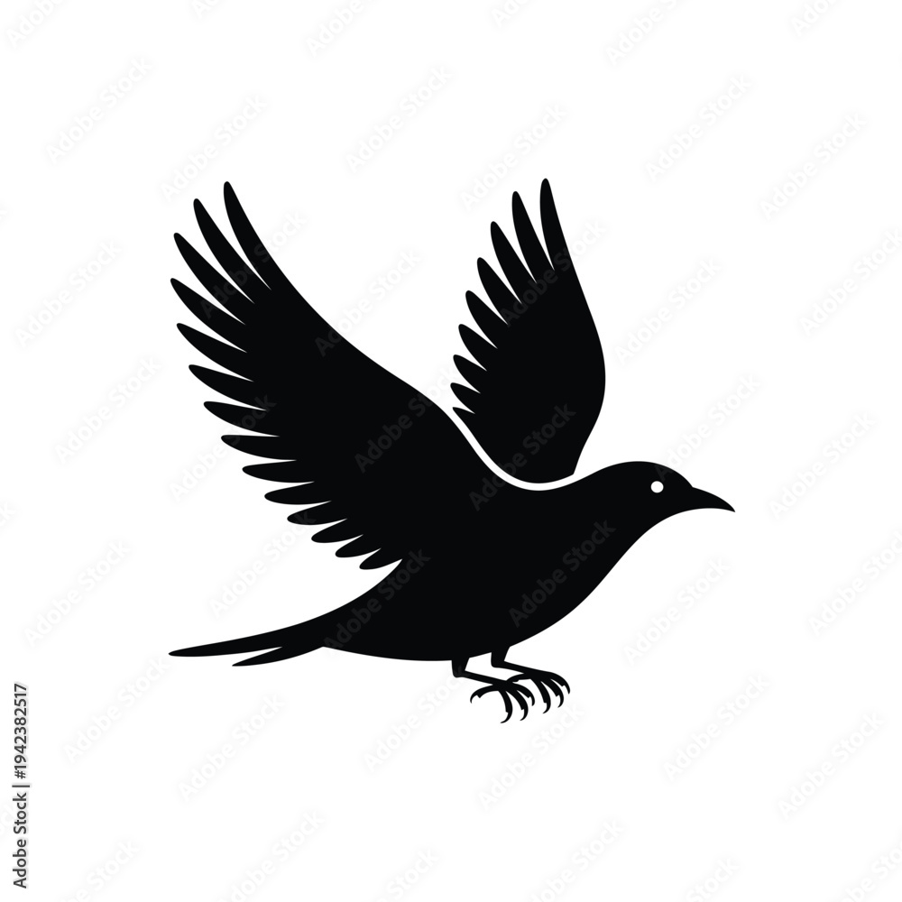 Obraz premium A black silhouette of a bird with outstretched wings in flight