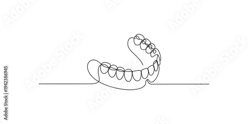 Continuous line drawing of a dental denture on a flat surface teeth