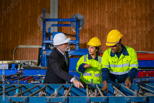 Schilderij op canvas White collar worker and blue collar workers are working together at metal sheet factory