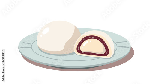 Traditional Japanese mochi dessert with sweet red bean filling shown whole and cut in half on a simple ceramic serving plate.