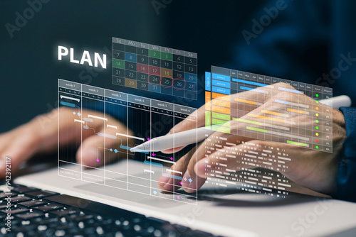 Business professional managing project timeline and planning strategy using digital gantt chart interface on laptop. Concept of project management, workflow organization, and business planning.