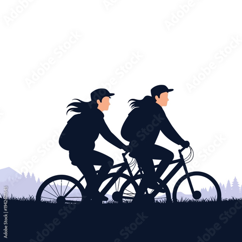 Two people riding bicycles together in silhouette against a pale sky with mountains and trees